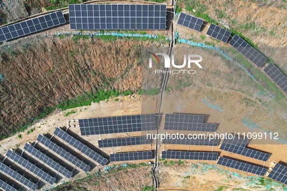 A photovoltaic power generation facility at an abandoned mine is being seen from the air in Hangzhou, Zhejiang Province, China, on March 26,...