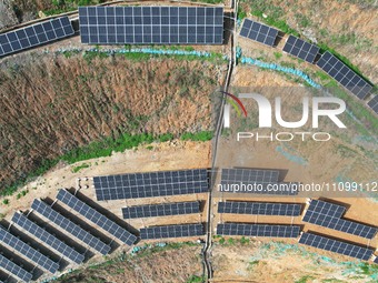 A photovoltaic power generation facility at an abandoned mine is being seen from the air in Hangzhou, Zhejiang Province, China, on March 26,...