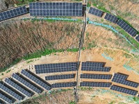 A photovoltaic power generation facility at an abandoned mine is being seen from the air in Hangzhou, Zhejiang Province, China, on March 26,...