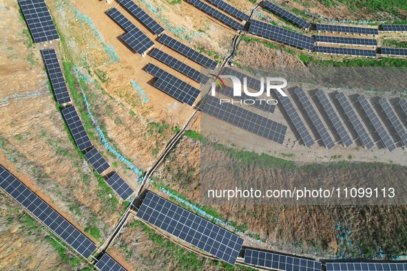 A photovoltaic power generation facility at an abandoned mine is being seen from the air in Hangzhou, Zhejiang Province, China, on March 26,...