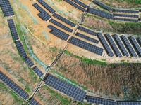 A photovoltaic power generation facility at an abandoned mine is being seen from the air in Hangzhou, Zhejiang Province, China, on March 26,...