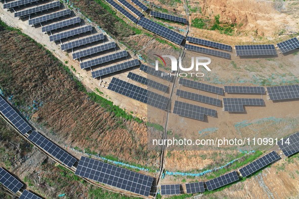 A photovoltaic power generation facility at an abandoned mine is being seen from the air in Hangzhou, Zhejiang Province, China, on March 26,...