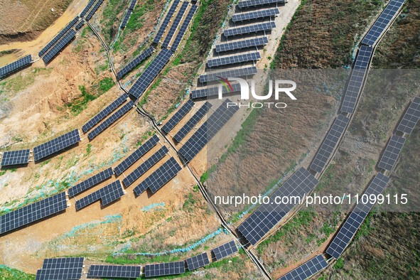 A photovoltaic power generation facility at an abandoned mine is being seen from the air in Hangzhou, Zhejiang Province, China, on March 26,...