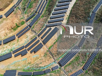 A photovoltaic power generation facility at an abandoned mine is being seen from the air in Hangzhou, Zhejiang Province, China, on March 26,...