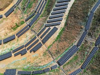 A photovoltaic power generation facility at an abandoned mine is being seen from the air in Hangzhou, Zhejiang Province, China, on March 26,...