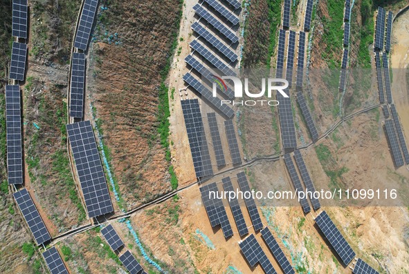 A photovoltaic power generation facility at an abandoned mine is being seen from the air in Hangzhou, Zhejiang Province, China, on March 26,...