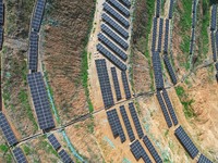 A photovoltaic power generation facility at an abandoned mine is being seen from the air in Hangzhou, Zhejiang Province, China, on March 26,...