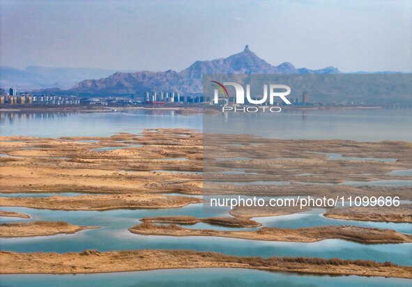 An aerial photo is showing the scenery of Wuhai Lake in Wuhai City, Inner Mongolia Autonomous Region, North China, on March 26, 2024. 