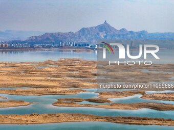 An aerial photo is showing the scenery of Wuhai Lake in Wuhai City, Inner Mongolia Autonomous Region, North China, on March 26, 2024. (