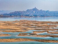 An aerial photo is showing the scenery of Wuhai Lake in Wuhai City, Inner Mongolia Autonomous Region, North China, on March 26, 2024. (