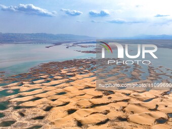 An aerial photo is showing the scenery of Wuhai Lake in Wuhai City, Inner Mongolia Autonomous Region, North China, on March 26, 2024. (