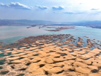 An aerial photo is showing the scenery of Wuhai Lake in Wuhai City, Inner Mongolia Autonomous Region, North China, on March 26, 2024. (