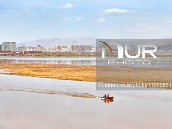 An aerial photo is showing the scenery of Wuhai Lake in Wuhai City, Inner Mongolia Autonomous Region, North China, on March 26, 2024. (