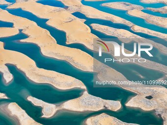 An aerial photo is showing the scenery of Wuhai Lake in Wuhai City, Inner Mongolia Autonomous Region, North China, on March 26, 2024. (