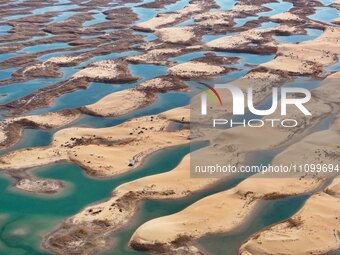 An aerial photo is showing the scenery of Wuhai Lake in Wuhai City, Inner Mongolia Autonomous Region, North China, on March 26, 2024. (