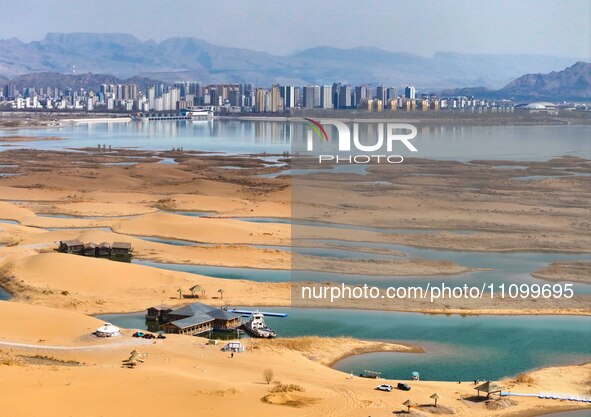 An aerial photo is showing the scenery of Wuhai Lake in Wuhai City, Inner Mongolia Autonomous Region, North China, on March 26, 2024. 