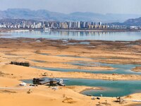 An aerial photo is showing the scenery of Wuhai Lake in Wuhai City, Inner Mongolia Autonomous Region, North China, on March 26, 2024. (