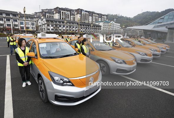 New energy taxis are being put into operation in Yichang, Hubei Province, China, on March 26, 2024. 