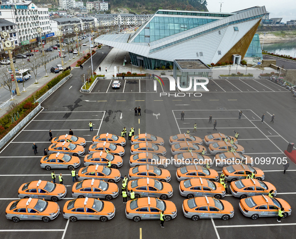 New energy taxis are being put into operation in Yichang, Hubei Province, China, on March 26, 2024. 