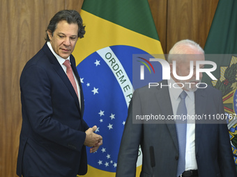 Brazil's President Luiz Inacio Lula da Silva and Finance Minister Fernando Haddad are participating in a ceremony at the Planalto Palace in...