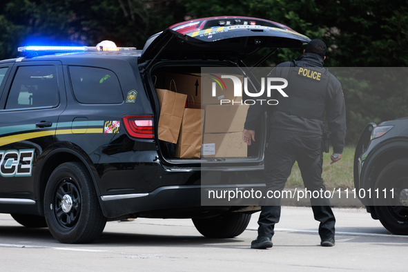 Maryland Transportation Authority Police work alongside Maryland Department of Transportation officials to deliver supplies to emergency off...