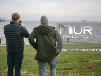 People view the collapsed Francis Scott Key Bridge in Baltimore, Maryland from the Fort McHenry National Monument and Historic Shrine on Mar...