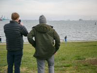 People view the collapsed Francis Scott Key Bridge in Baltimore, Maryland from the Fort McHenry National Monument and Historic Shrine on Mar...