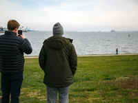 People view the collapsed Francis Scott Key Bridge in Baltimore, Maryland from the Fort McHenry National Monument and Historic Shrine on Mar...