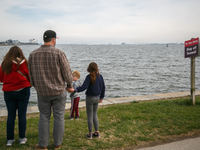 People view the collapsed Francis Scott Key Bridge in Baltimore, Maryland from the Fort McHenry National Monument and Historic Shrine on Mar...