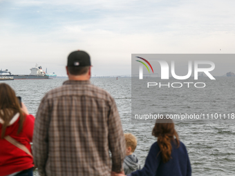 People view the collapsed Francis Scott Key Bridge in Baltimore, Maryland from the Fort McHenry National Monument and Historic Shrine on Mar...