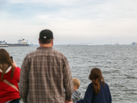 People view the collapsed Francis Scott Key Bridge in Baltimore, Maryland from the Fort McHenry National Monument and Historic Shrine on Mar...