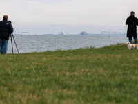 People view the collapsed Francis Scott Key Bridge in Baltimore, Maryland from the Fort McHenry National Monument and Historic Shrine on Mar...