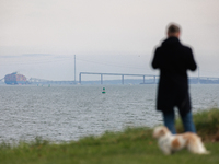 People view the collapsed Francis Scott Key Bridge in Baltimore, Maryland from the Fort McHenry National Monument and Historic Shrine on Mar...