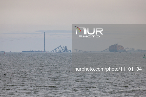 The collapsed Francis Scott Key Bridge is seen from the Fort McHenry National Monument and Historic Shrine in Baltimore, Maryland on March 2...