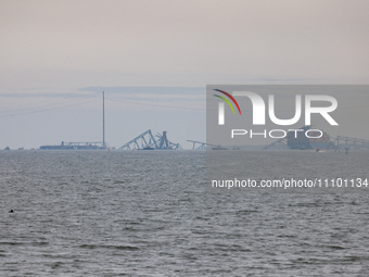 The collapsed Francis Scott Key Bridge is seen from the Fort McHenry National Monument and Historic Shrine in Baltimore, Maryland on March 2...