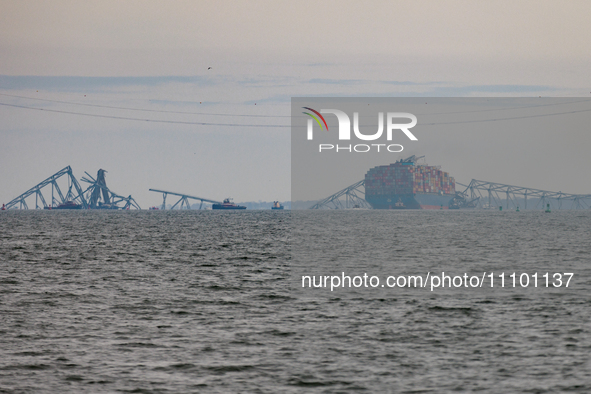 The collapsed Francis Scott Key Bridge is seen from the Fort McHenry National Monument and Historic Shrine in Baltimore, Maryland on March 2...