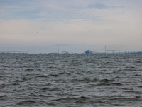 The collapsed Francis Scott Key Bridge is seen from the Fort McHenry National Monument and Historic Shrine in Baltimore, Maryland on March 2...