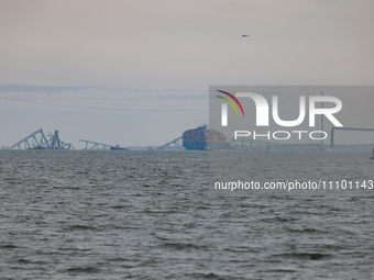 The collapsed Francis Scott Key Bridge is seen from the Fort McHenry National Monument and Historic Shrine in Baltimore, Maryland on March 2...