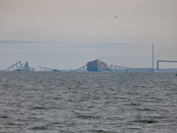 The collapsed Francis Scott Key Bridge is seen from the Fort McHenry National Monument and Historic Shrine in Baltimore, Maryland on March 2...