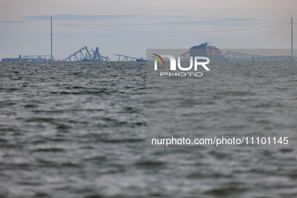 The collapsed Francis Scott Key Bridge is seen from the Fort McHenry National Monument and Historic Shrine in Baltimore, Maryland on March 2...