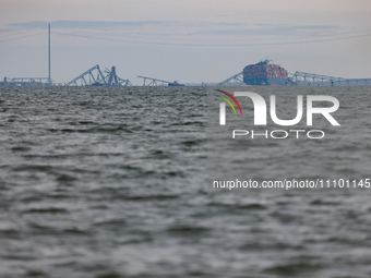 The collapsed Francis Scott Key Bridge is seen from the Fort McHenry National Monument and Historic Shrine in Baltimore, Maryland on March 2...