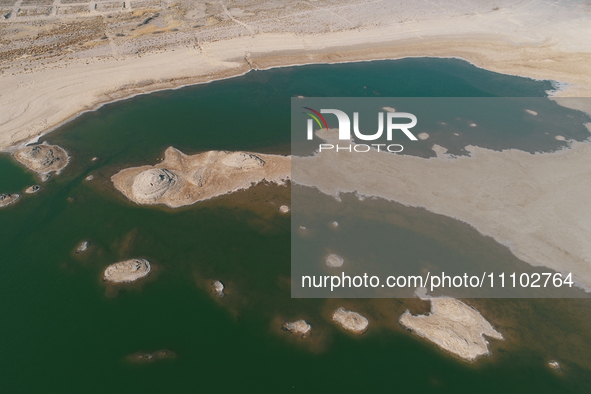 A view of the arid Yadan landscape with a moist lake nestled in the depths of the Gobi desert in Hami, Xinjiang province, China, on March 24...