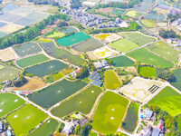 An aerial photo is showing fish ponds nestled between villages, fields, and rivers in Chongqing, China, on March 28, 2024. (