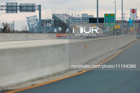 The collapsed Francis Scott Key Bridge is seen from a media staging area at the Maryland Tansportation Authority headquarters in Dundalk, Ma...