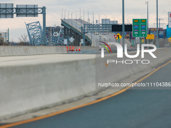 The collapsed Francis Scott Key Bridge is seen from a media staging area at the Maryland Tansportation Authority headquarters in Dundalk, Ma...