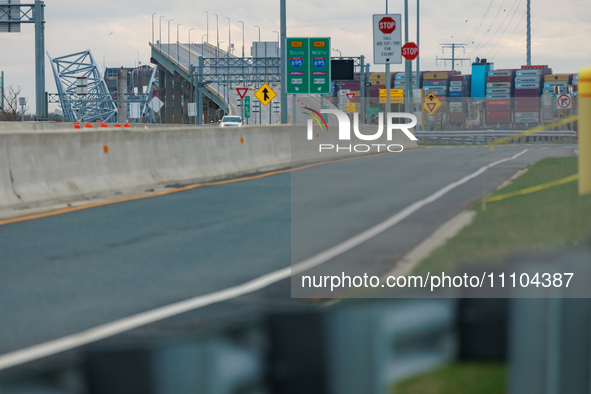 The collapsed Francis Scott Key Bridge is seen from a media staging area at the Maryland Tansportation Authority headquarters in Dundalk, Ma...