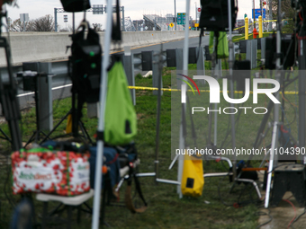 The collapsed Francis Scott Key Bridge is seen through a media staging area at the Maryland Tansportation Authority headquarters in Dundalk,...