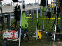 The collapsed Francis Scott Key Bridge is seen through a media staging area at the Maryland Tansportation Authority headquarters in Dundalk,...