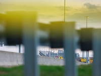 The collapsed Francis Scott Key Bridge is seen beyond police tape at a media staging area at the Maryland Tansportation Authority headquarte...