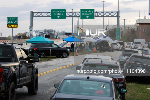 The collapsed Francis Scott Key Bridge is seen from a media staging area at the Maryland Tansportation Authority headquarters in Dundalk, Ma...